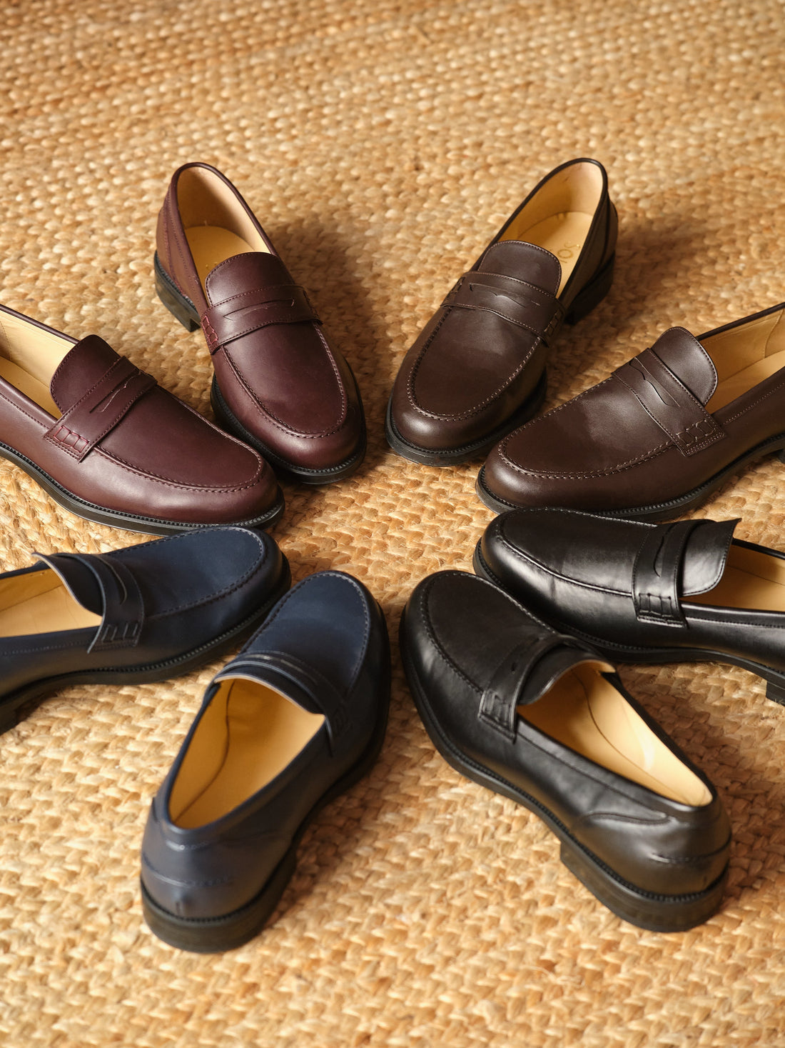 Best vegan shoe brands Italy 2026 featuring stylish loafers in various colors on a natural woven backdrop.